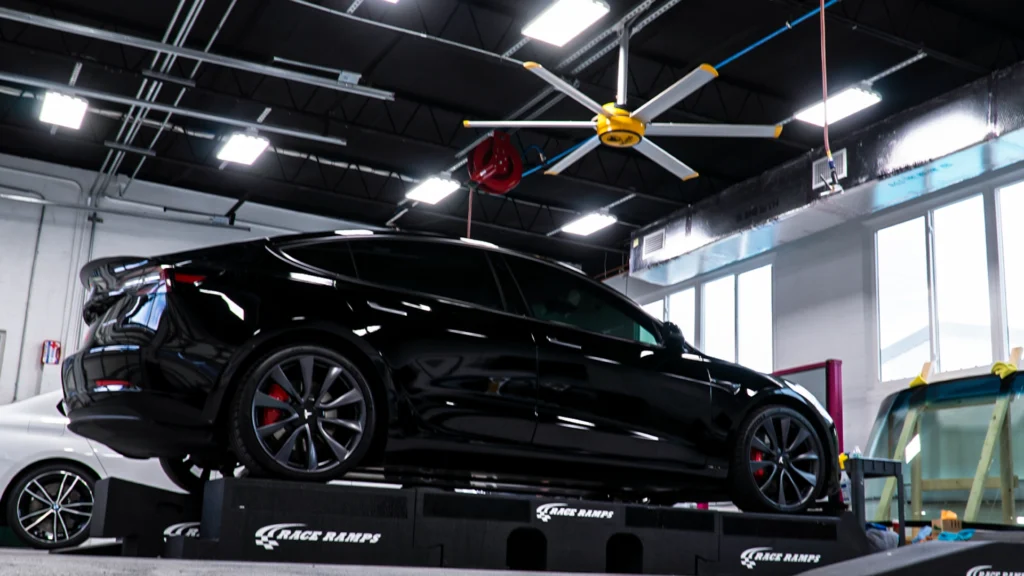 Tesla paint protection film being applied on RaceRamps.